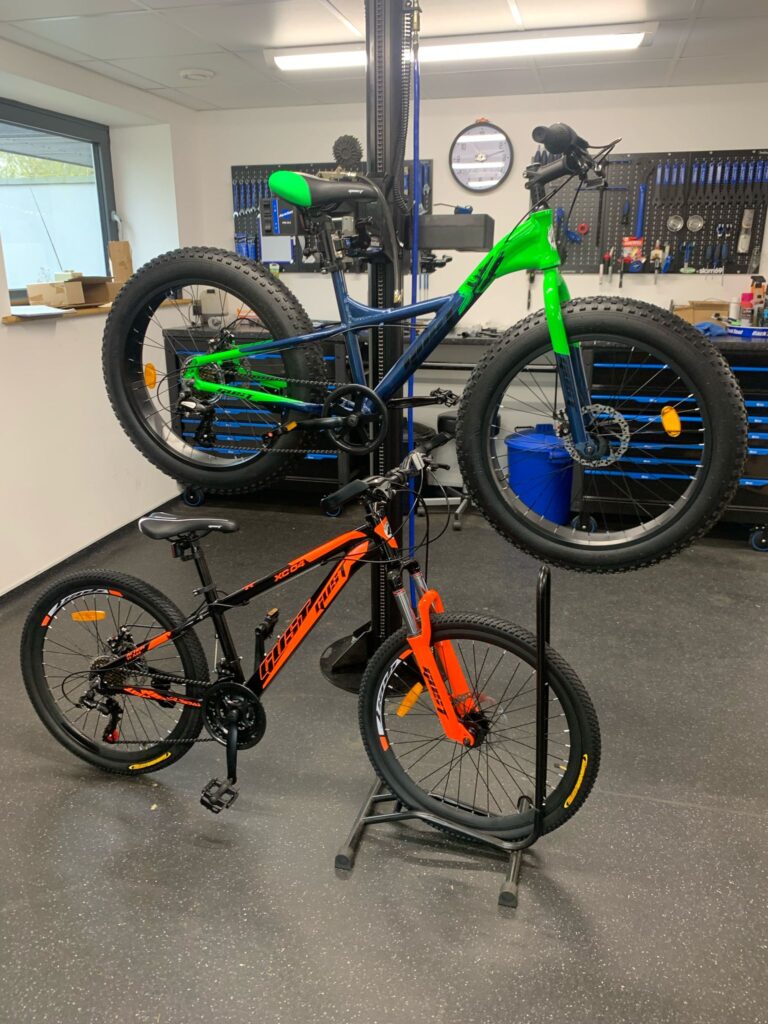 Black Bike fat tyre bicycle inspected by technician in UK workshop before packing and dispatch